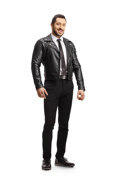 Full length portrait of a young handsome young man wearing a leather jacket and posing isolated on white background - Fotó, kép