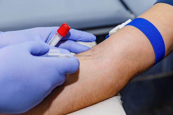 Blood tests in the laboratory, donor, test tube for laboratory, needle - Valokuva, kuva