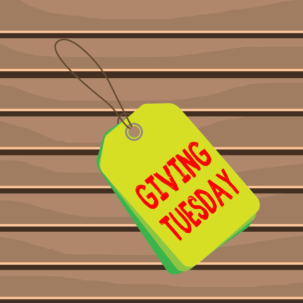 Konceptualne ręczne pismo pokazujące "Giving Tuesday". Biznes zdjęcie tekst międzynarodowy dzień charytatywny dając Hashtag aktywizm prostokąt plakietka dołączony ciąg kolorowe tło z tagiem. - Zdjęcie, obraz