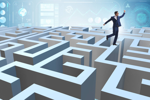 Businessman trying to escape from maze - Photo, Image