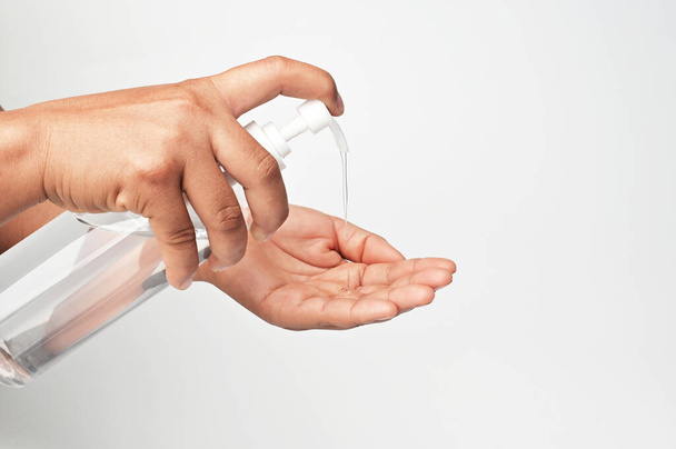 hand pump alcohol gel in bottle for cleaning coronavirus covid 19 on white background - Valokuva, kuva