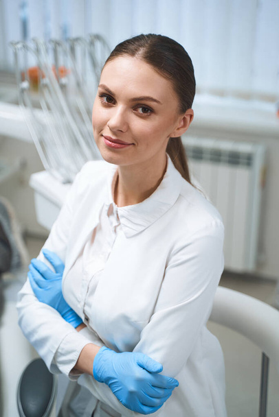 Cheerful young doctor in clinic stock photo - Foto, afbeelding
