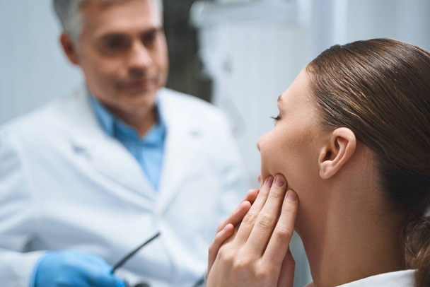 Woman coming to doctor because of toothache stock photo - Foto, immagini
