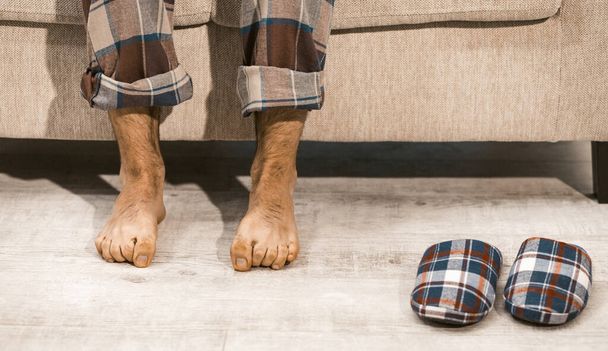 Male Legs Barefoot And Couple Slipper On Wooden Floor - Fotografie, Obrázek