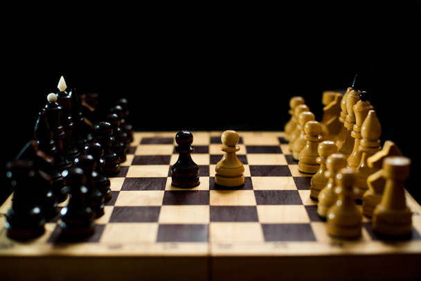 Chess is a logic Board game with special pieces on a 64-cell Board for two opponents, combining elements of art (in terms of chess composition), science and sports - Φωτογραφία, εικόνα