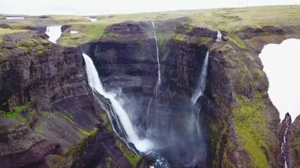Aerial over the beautiful and amazing high waterfall of Haifoss in Iceland. - Felvétel, videó