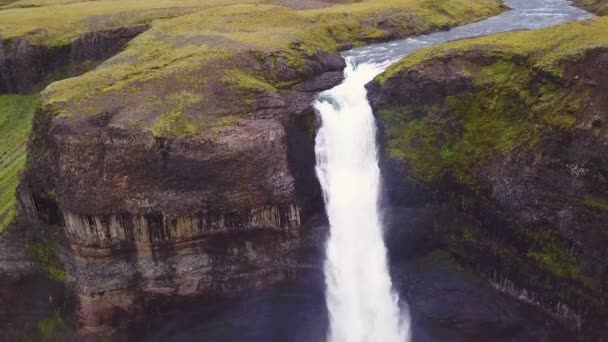 Aerial over the beautiful and amazing high waterfall of Haifoss in Iceland. - Materiał filmowy, wideo