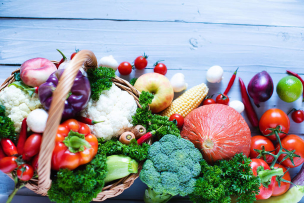 Various fresh vegetables  on a wooden background, top view. - Φωτογραφία, εικόνα