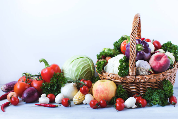 Heap of fresh fruits and vegetables on wooden background. Healthy food. - Photo, Image