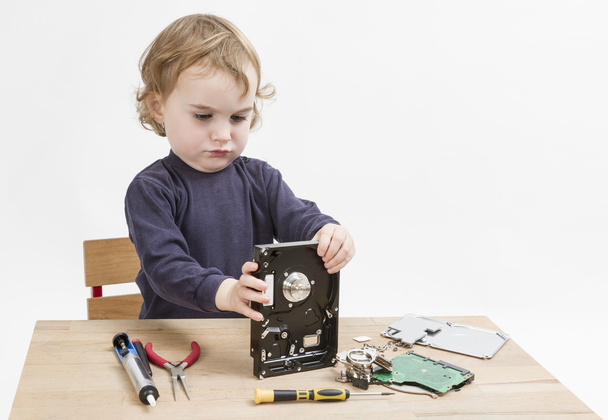 child repairing hard disk drive - Photo, Image