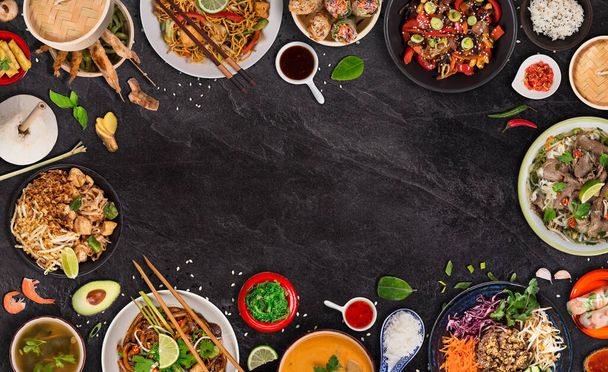 Asian food background with various ingredients on rustic stone background , top view. - Фото, изображение