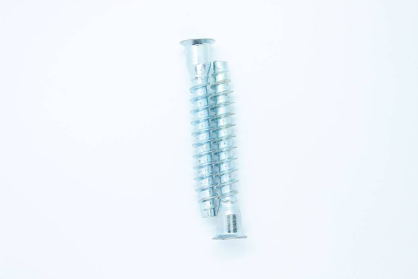 White metal screws located on a white background - Photo, Image