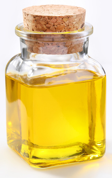Bottle of olive oil on a white background - Фото, изображение