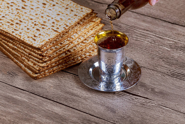 Jewish Pesah celebrating, matzoh and traditional kosher wine - Photo, Image
