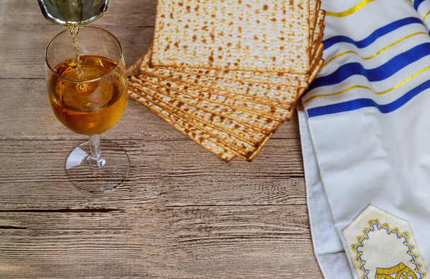 Jewish Passover holiday celebration, matza unleavened bread and cup kosher wine - Photo, Image