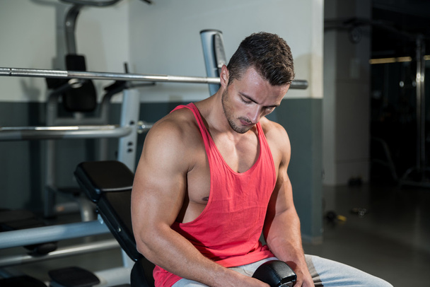 Young Muscular Caucasian Man Resting At The Bench - Photo, image