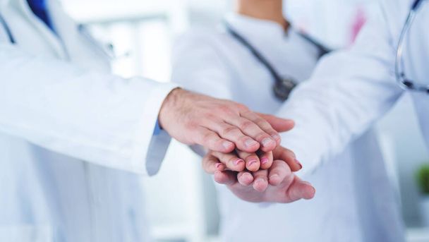 Doctors and nurses coordinate hands. Concept Teamwork in hospital for success work and trust in team - Foto, imagen