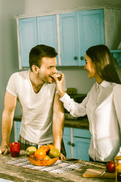 Smiling Couple Preparation Food At Home Kitchen - Fotografie, Obrázek