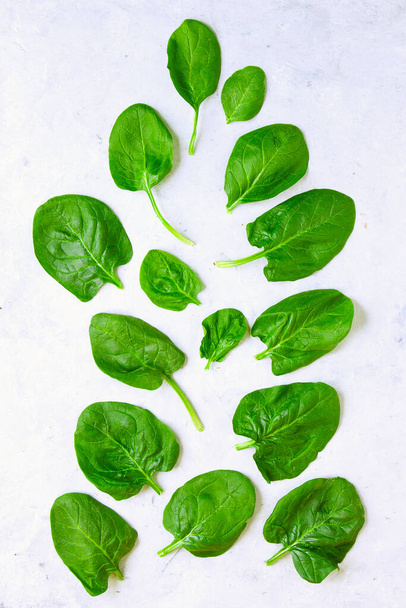 green fresh spinach leaves on a light background - Photo, Image