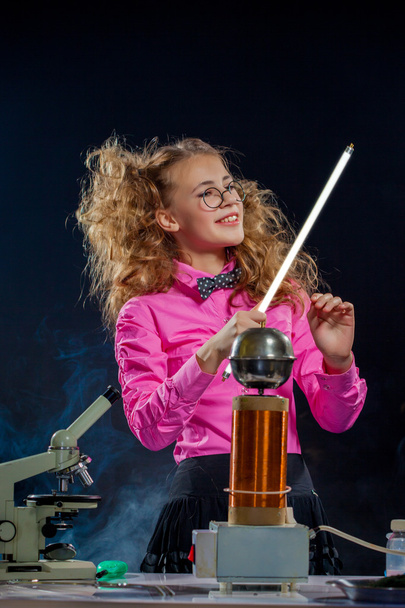 Portrait of adorable schoolgirl posing in lab - Foto, imagen