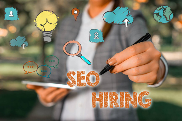 Word writing text Seo Hiring. Business concept for employing a specialist will develop content to include keywords. - Photo, Image