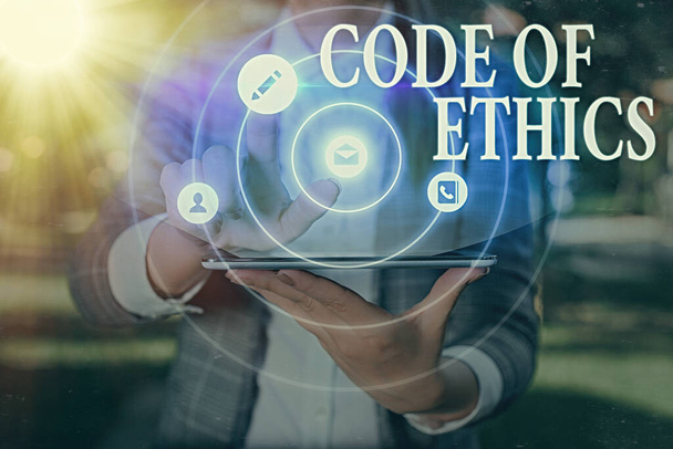 Handschrift tekst Code of Ethics. Begrip basisgids voor beroepsuitoefening en legt verplichtingen op. - Foto, afbeelding