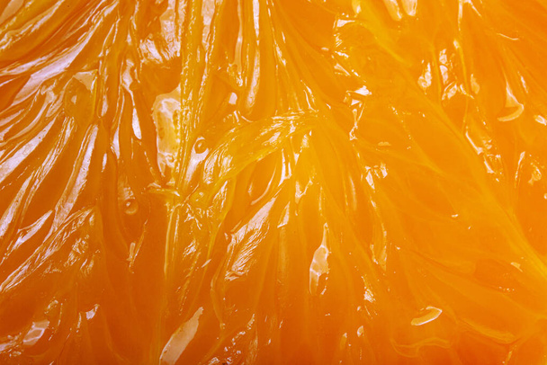 Close-up of  fresh orange slice over orange background. Bio and healthy food. - Fotoğraf, Görsel