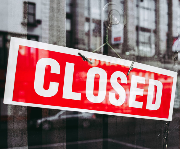 Closed sign in a shop window with reflections - Photo, Image