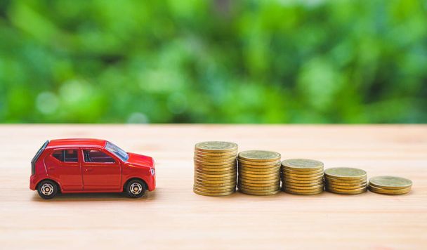 Car on stack of coin. Saving money for car concept. Car finance, buy car new concept. - Foto, Imagen