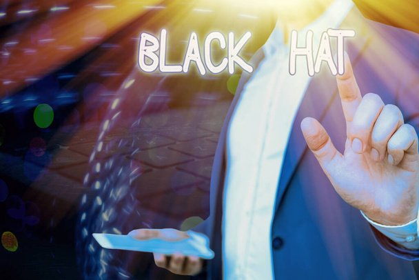 Conceptual hand writing showing Black Hat. Business photo showcasing used in reference to a bad demonstrating especially a villain or criminal. - Photo, Image