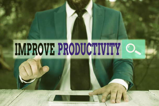 Nota de escritura que muestra Mejorar la productividad. Exhibición de fotos de negocios para aumentar la eficiencia de la máquina y el proceso
. - Foto, imagen