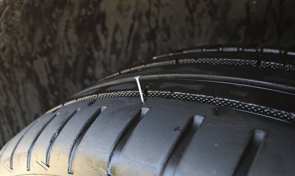 Run Flat Tire With Sticking Metal Nail  - Photo, Image