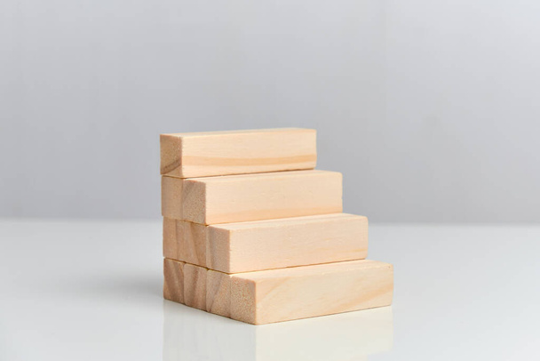 The concept of a finished business plan. Wooden blocks on a white background background. Close up. - Photo, Image