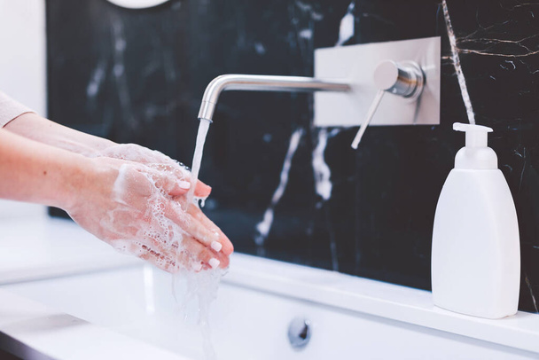 Washing hands with foam soap. Hygiene and healthcare, preventing coronavirus. - Foto, Imagen