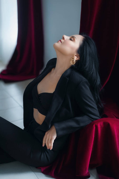 portrait of a beautiful young woman in black jacket - Zdjęcie, obraz