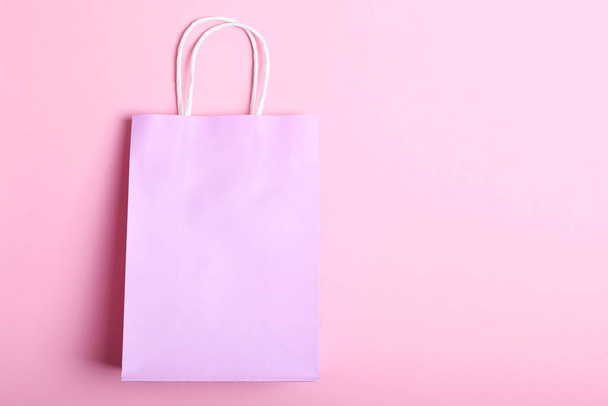 packages for shopping on a colored background top view. Minimalism, place for text. - 写真・画像