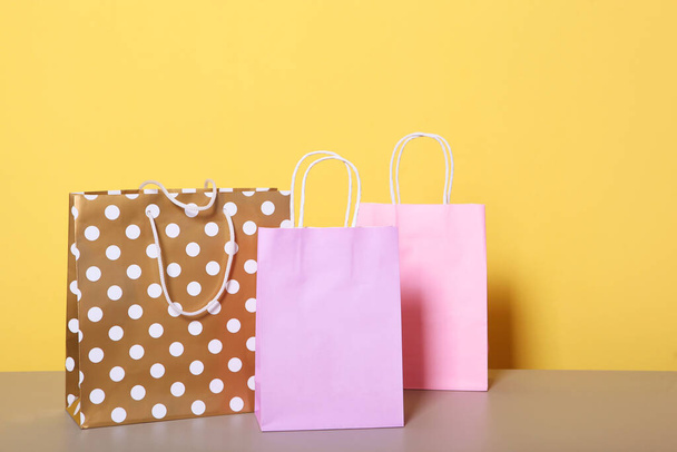 bags for shopping on a colored background. Paper bags for shopping. - Fotografie, Obrázek
