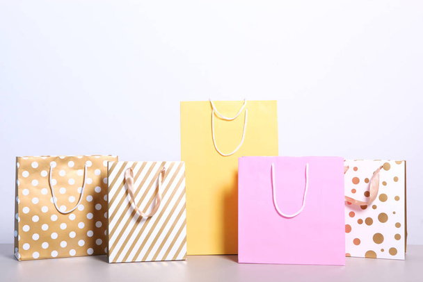 bags for shopping on a colored background. Paper bags for shopping. - Photo, Image