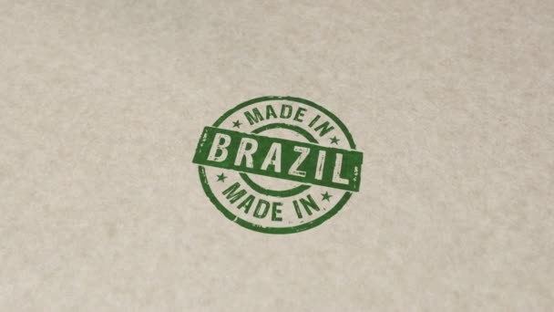 Brezilya pulu ve el damgası ile yapılan çarpışma animasyonu. Fabrika, iş, ihracat, üretim ve üretim ülkesi 3 boyutlu kavram. - Video, Çekim
