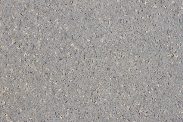 Texture of gray asphalt with dust and stones - 写真・画像
