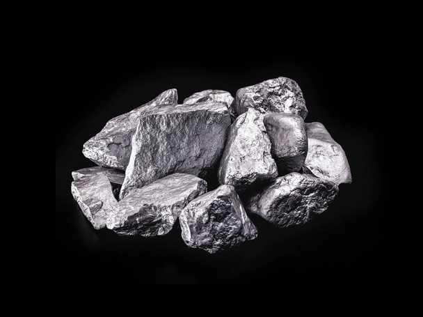 piece of silver or platinum on the stone floor, on black background. Export ore from south africa - Photo, Image