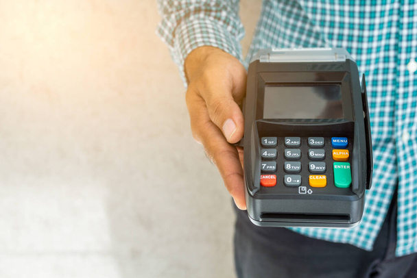 Hand man with credit card machine. - Фото, изображение