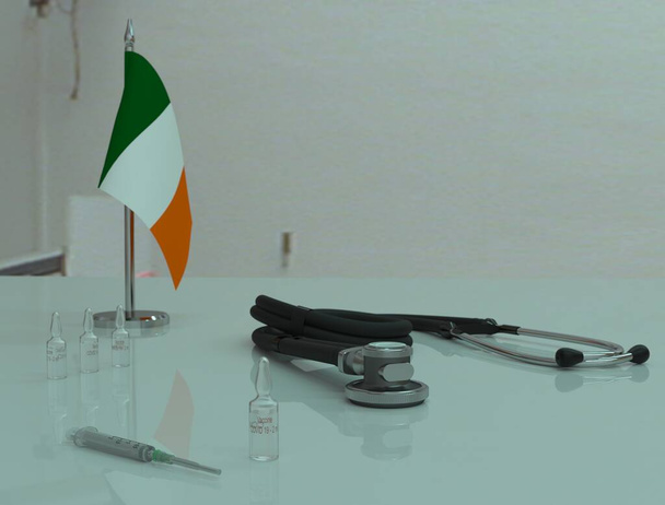 Syringe, COVID 19 coronovirus vaccine and phonendoscope on a medical table in the Republic of Ireland. - Photo, Image