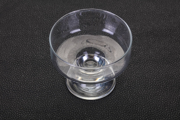 Empty glass bowl over black background - Photo, Image