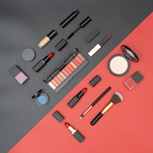 set decorative cosmetics on black and red background - Foto, Imagem