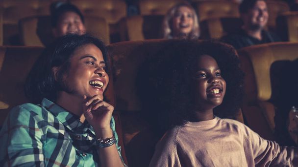 People audience watching movie in the movie theater cinema. Group recreation activity and entertainment concept. - 写真・画像