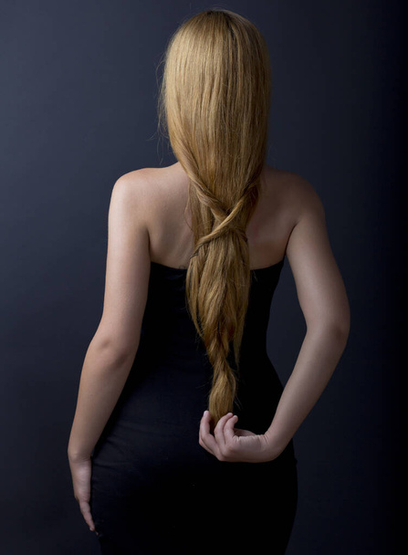 Beautiful female back. Portrait of a long haired woman. Back. - Photo, Image