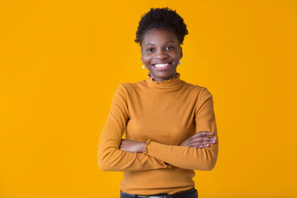 beautiful young african woman on yellow background - Φωτογραφία, εικόνα