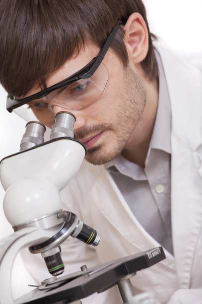 Researcher looking in microscope - Foto, Imagem