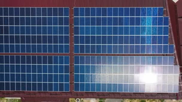 Solar panel reflecting the sun. Phototovoltaic panels on the roof with sunlight - Video